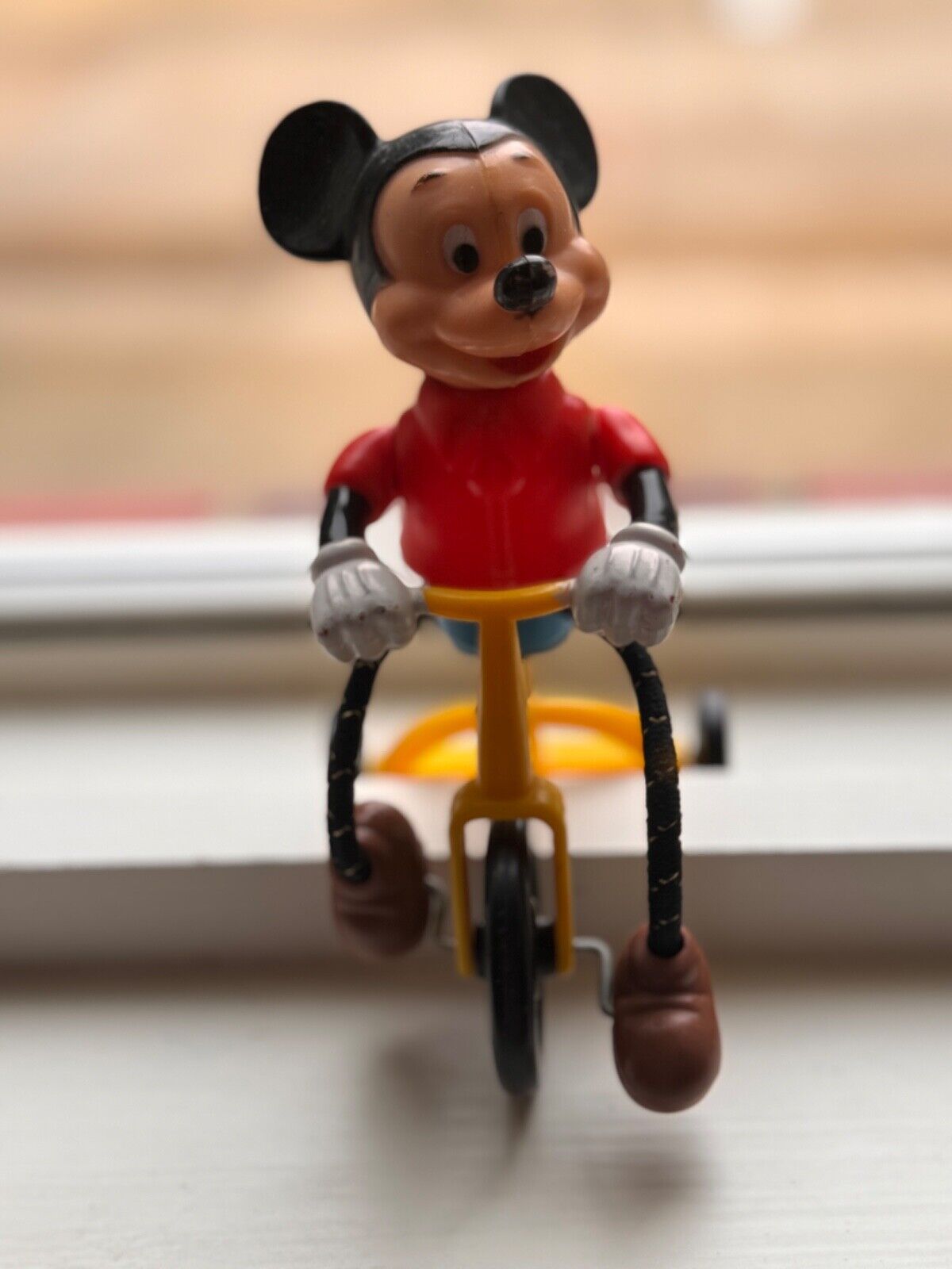 Vintage Mickey Mouse on moving tricycle