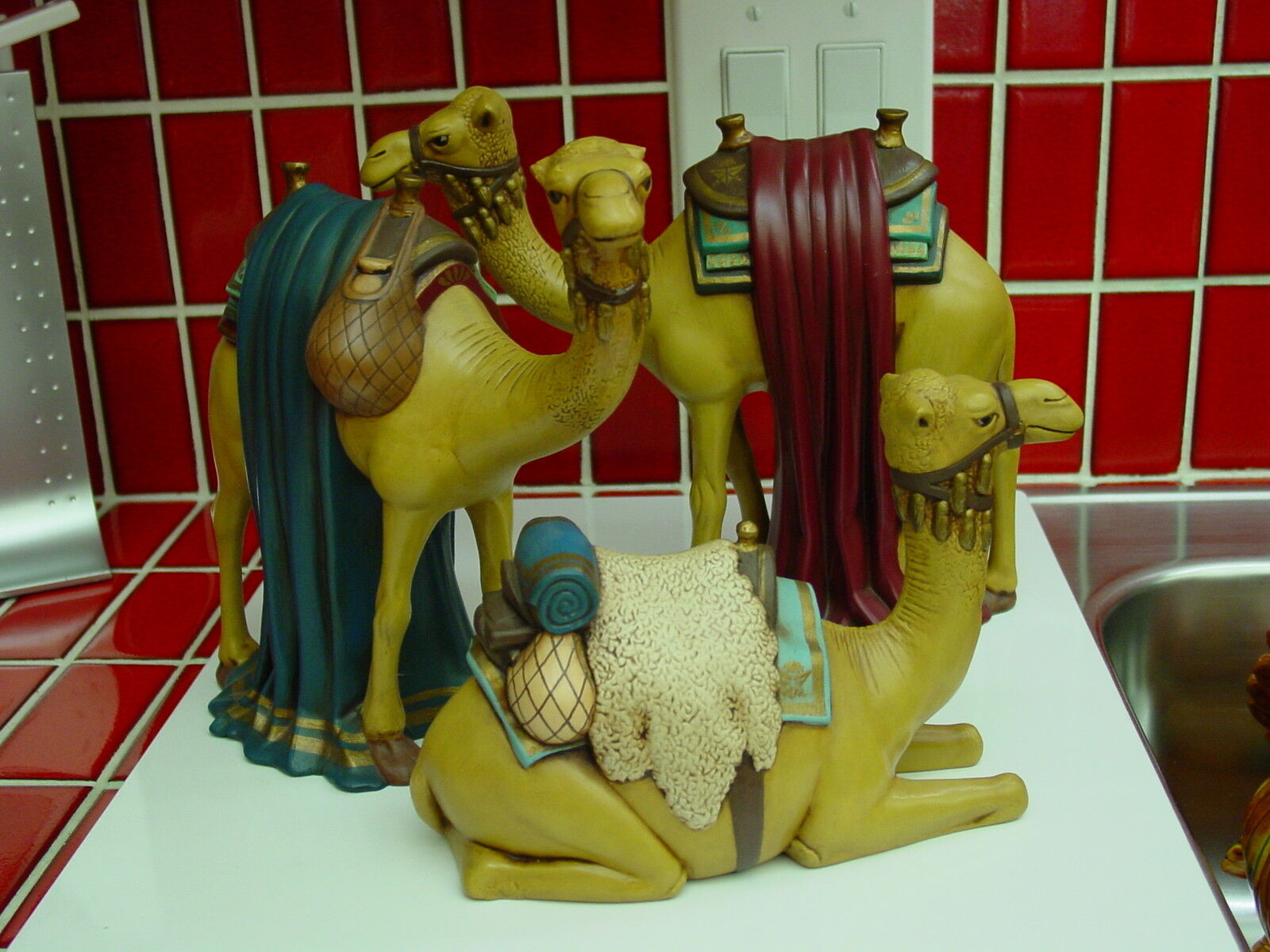 Set of 3 beautifully detailed, hand-painted ceramic camels