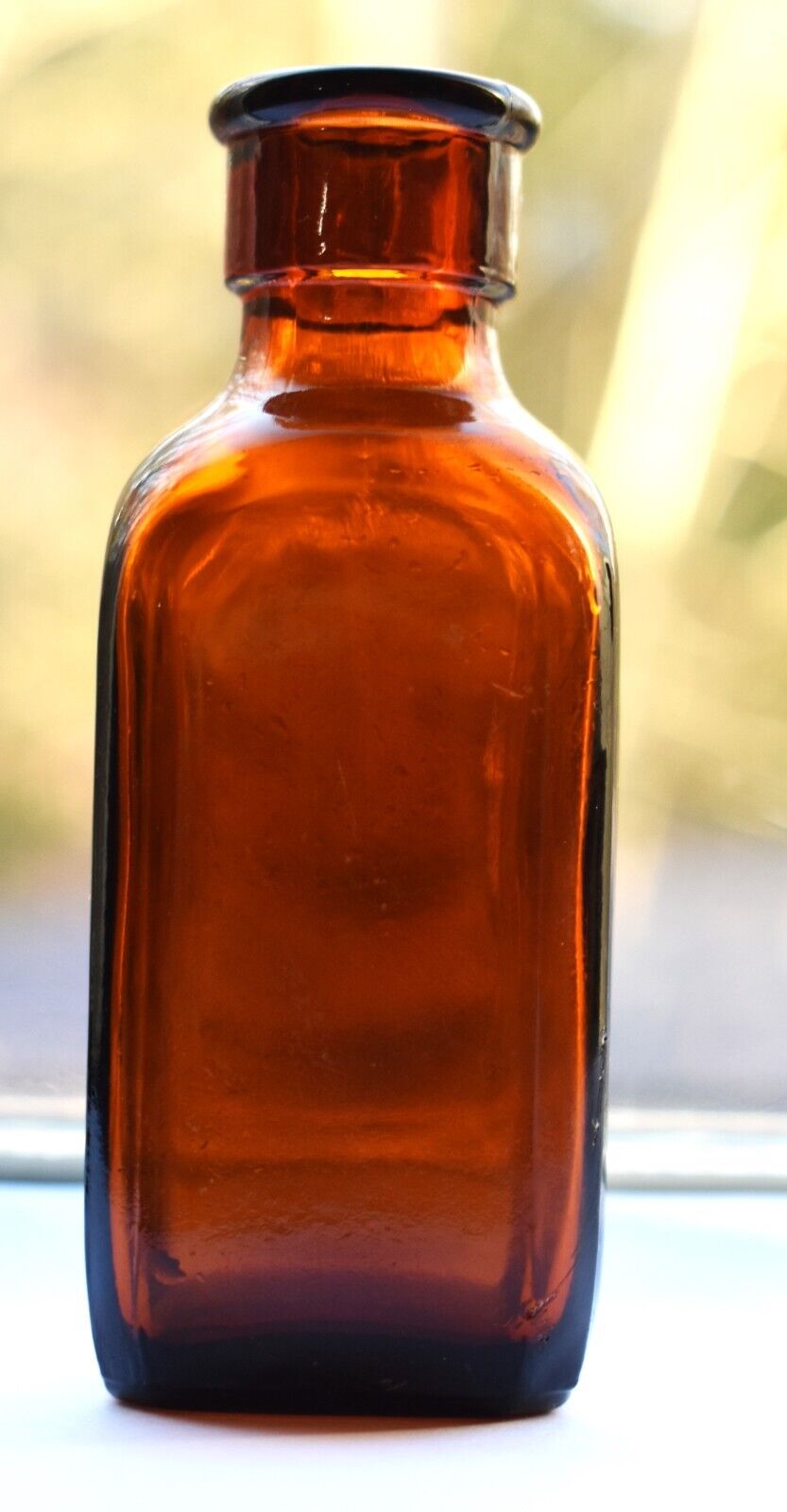 Antique Amber Glass Bottle made by Tibby Brothers Glass