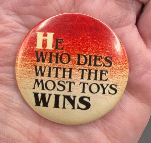 Vintage He Who Dies With The Most Toys Wins Pin PinBack Button 1.75\