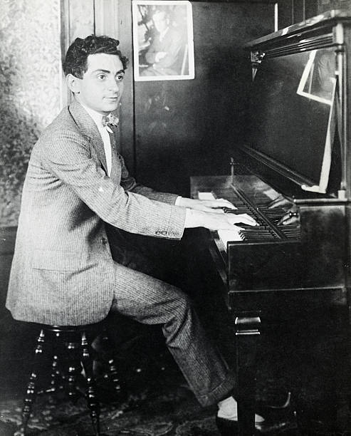 Composer Irving Berlin Is Shown Seated At A Piano Playing Historic Old Photo