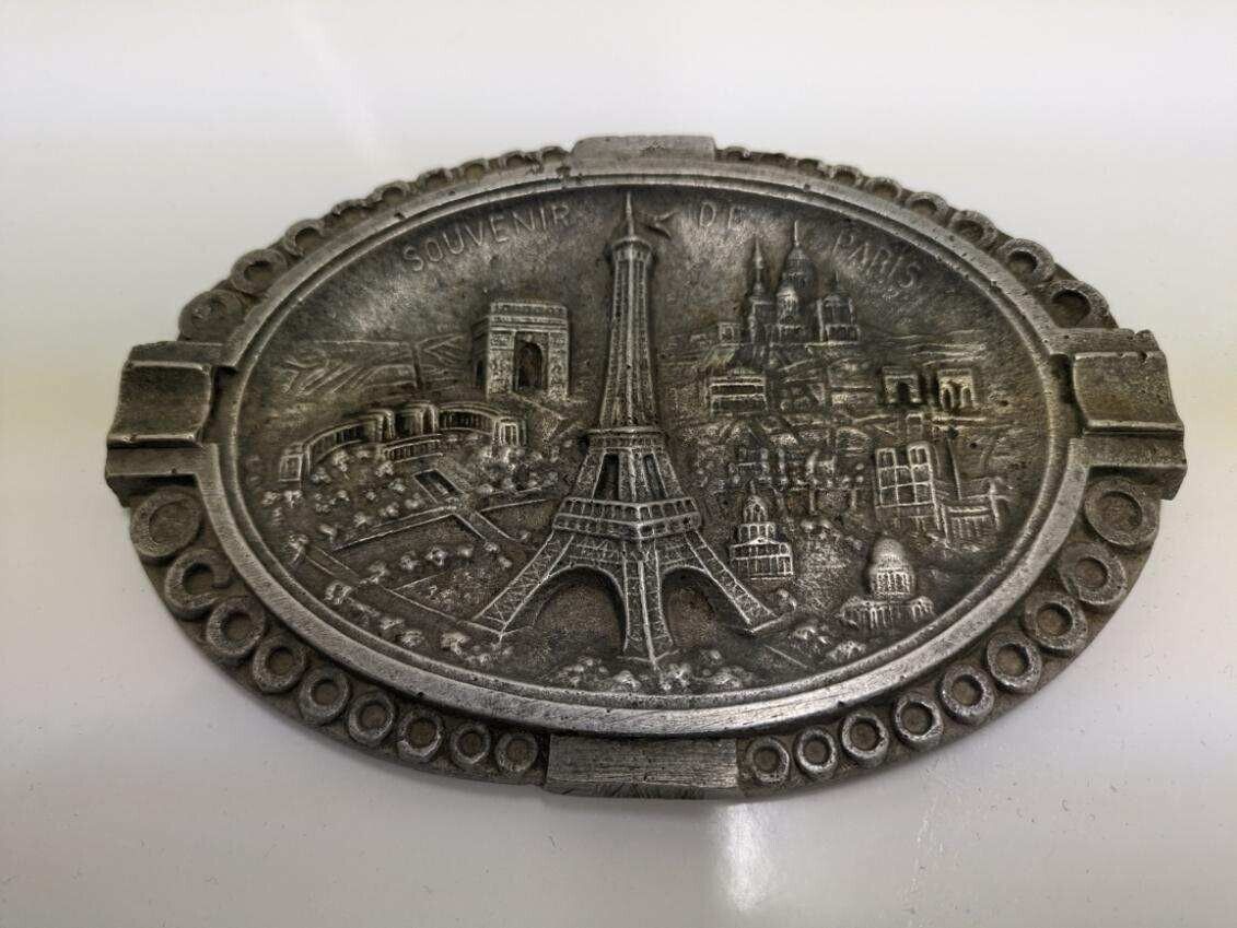 Vtg. Souvenir De Paris relief ovalesque metal ashtray.