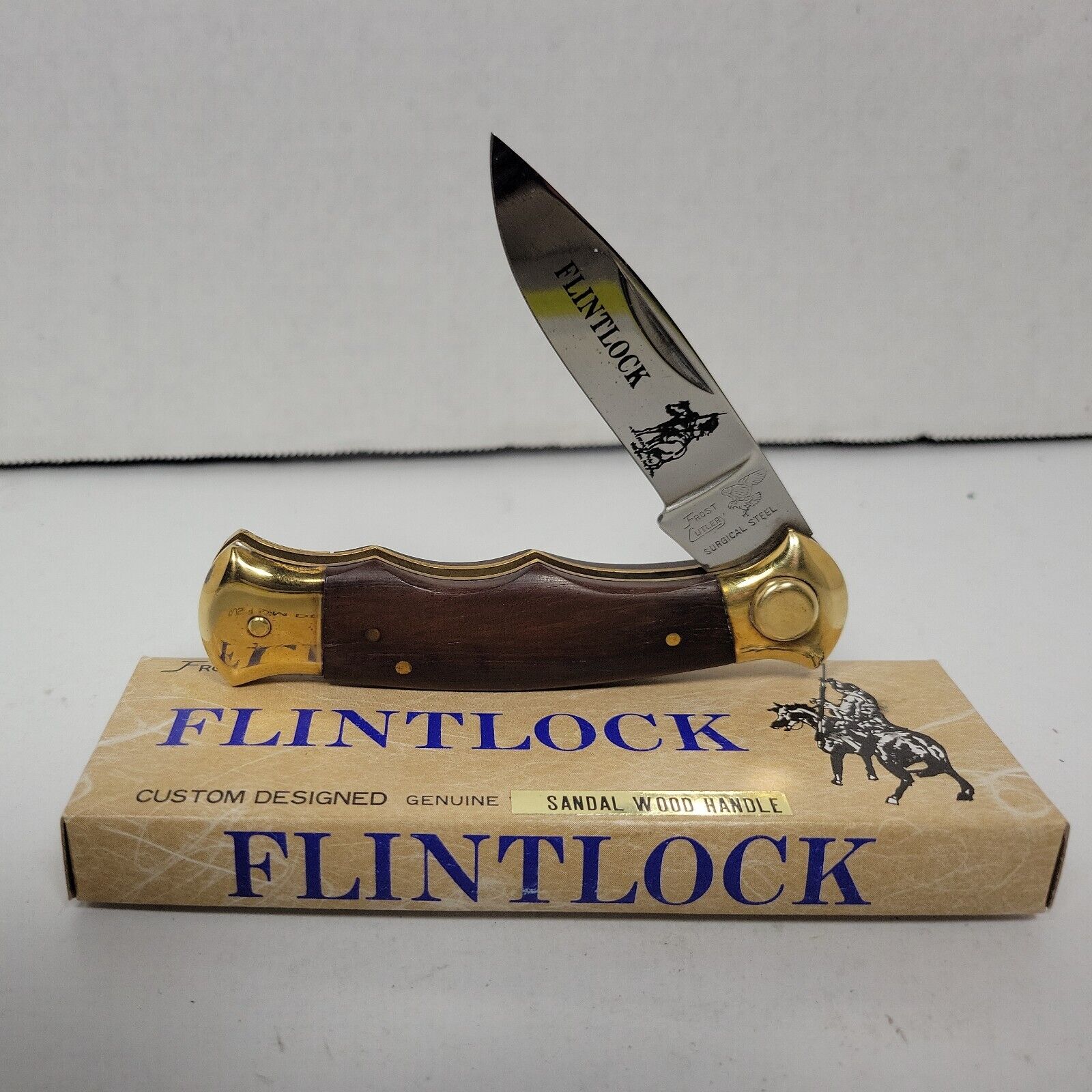 Frost Cutlery Flintlock Button Lock Sandal Wood Handle. AK302/4 NOS 6-3/4\