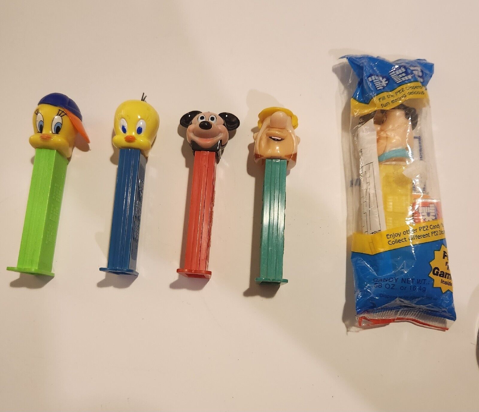 Vintage Pezz Dispensers 2 Tweety, 1 Micky Mouse, 1 Barney Rubble And 1 Fred...