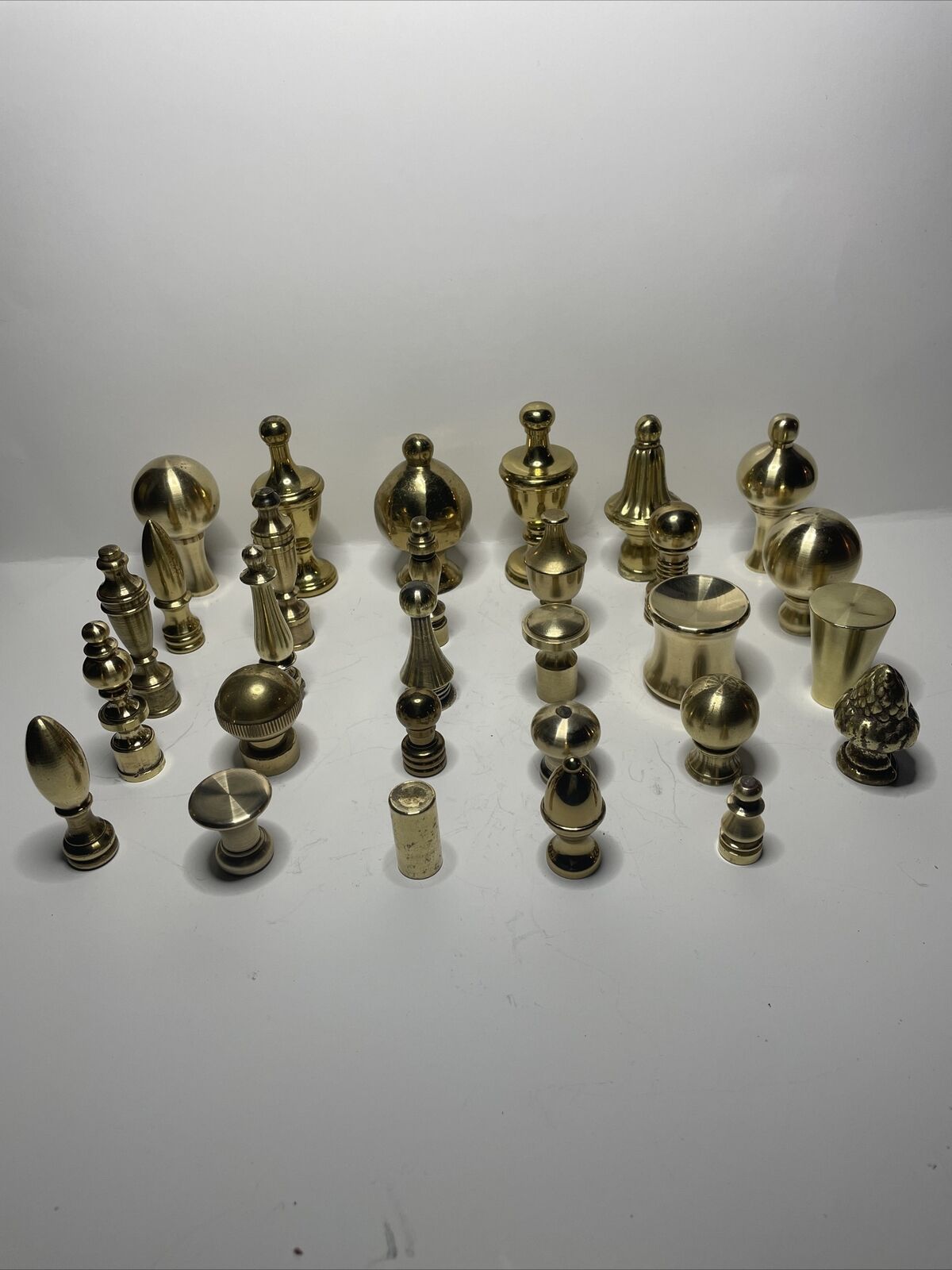 lot of 29 solid polished brass lamp finials.  vintage and modern designs