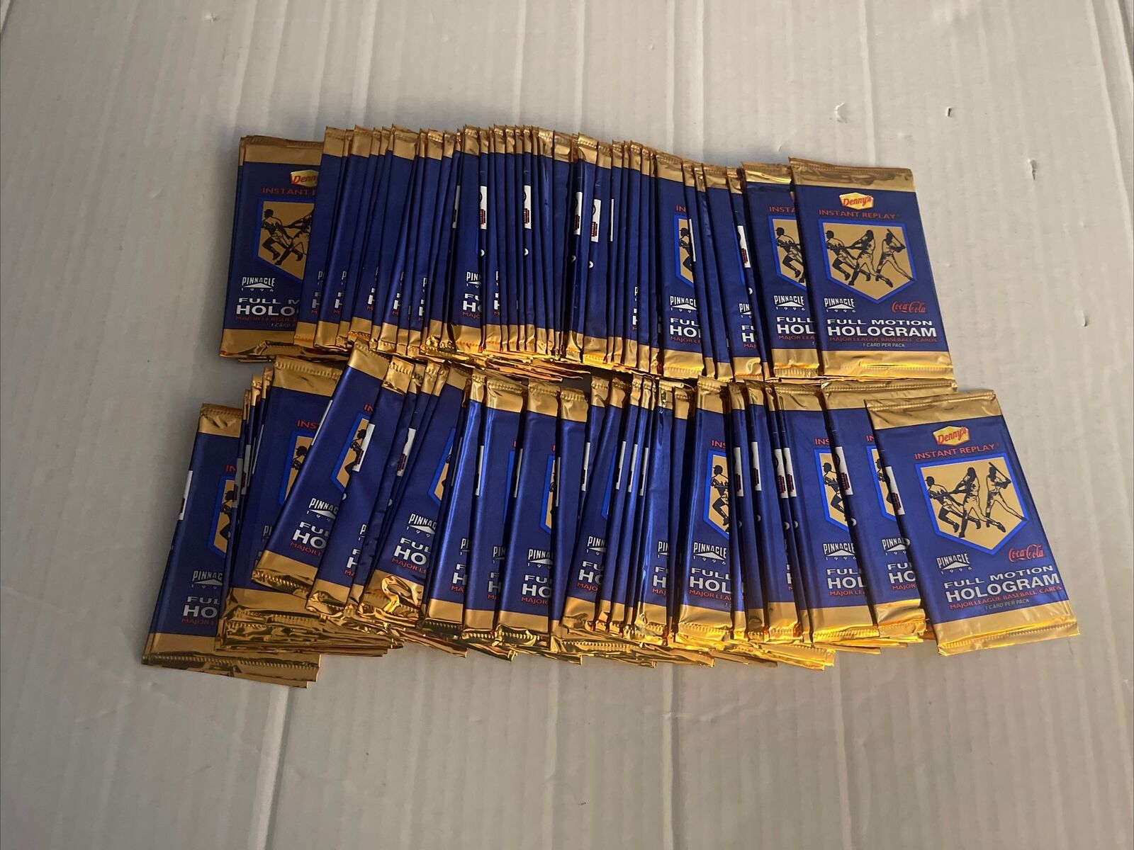 Lot of (100) 1996 Unopened Pack Pinnacle Dennys Instant Replay Full Motion Holo