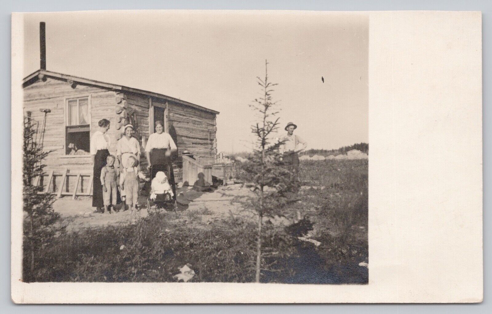 c1904 Very Old RPPC - CYKO Stamp Box - Women Children in Front of Log cabin - B2