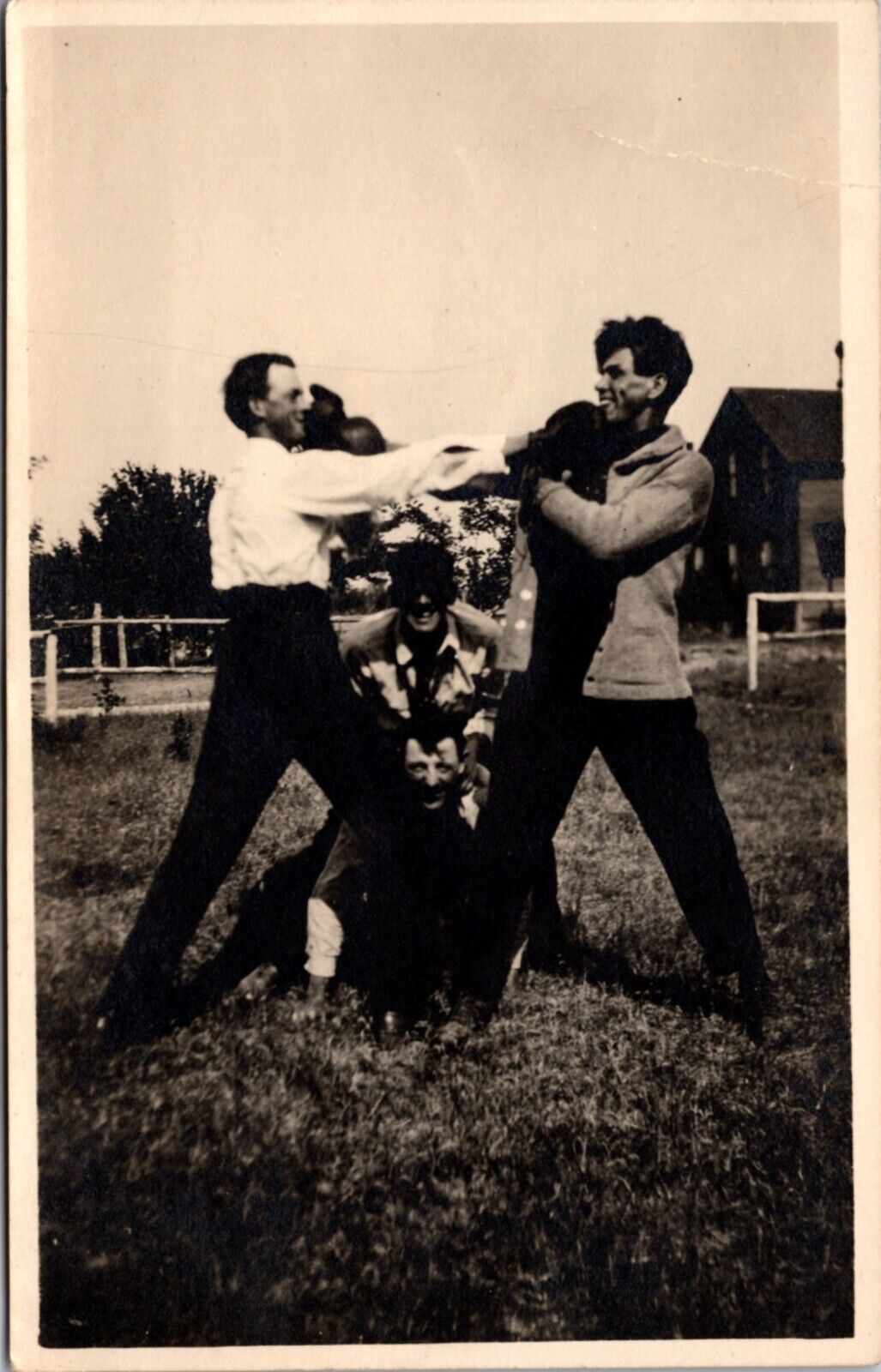 Real Photo Postcard Four Men Playing Around in Field with Boxing Gloves