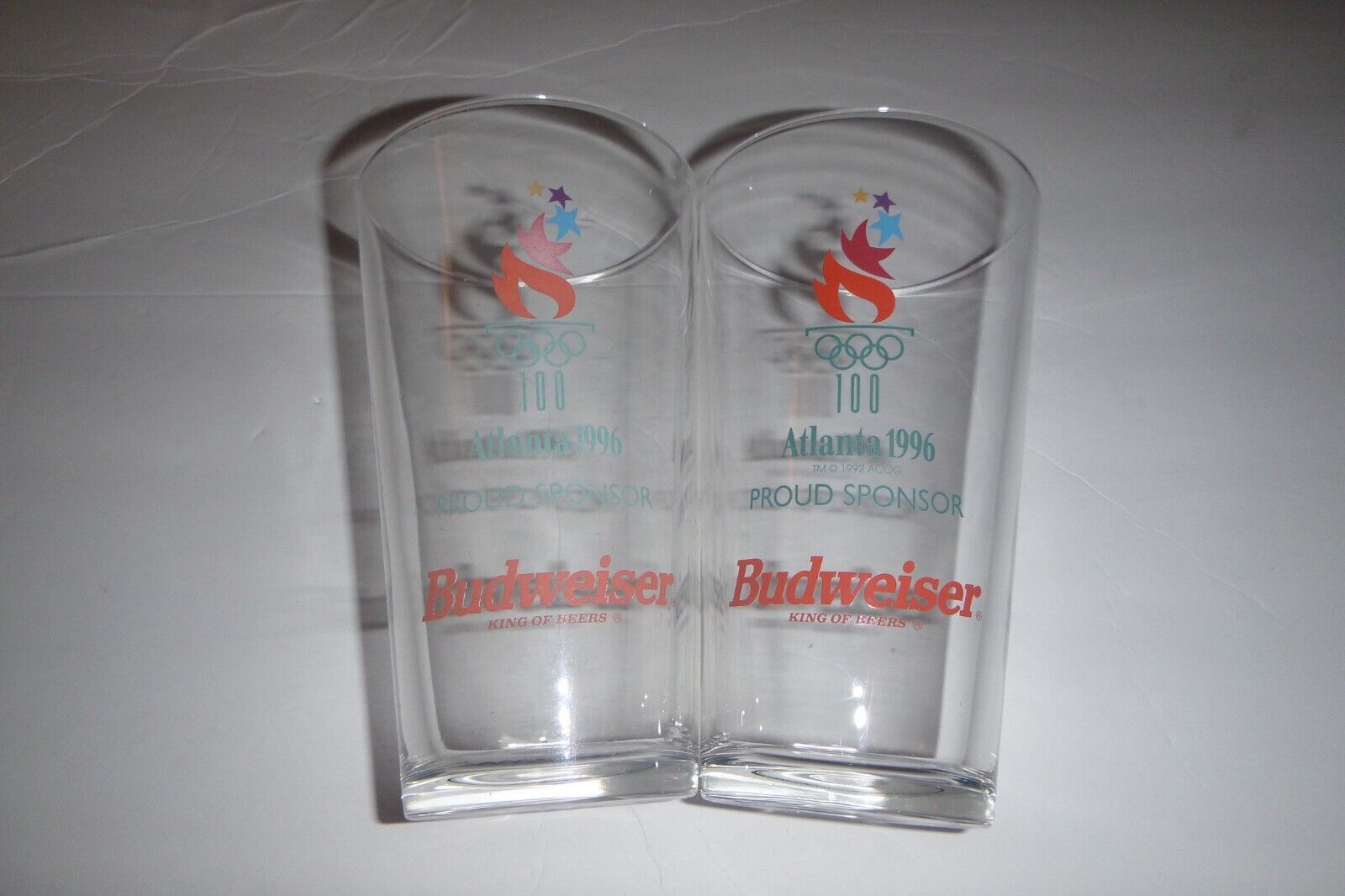 2 Pc Atlanta 1996 Proud Sponsor Bud Weiser King of Beers Glasses 6in tall