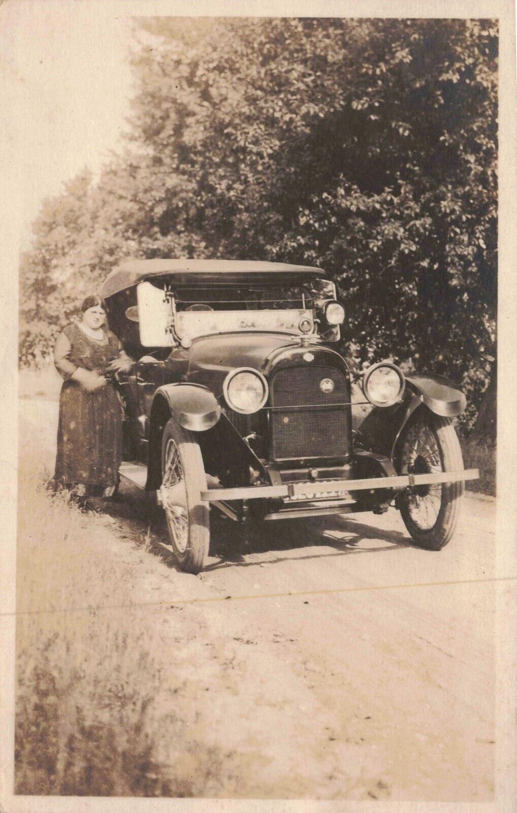 RPPC Woman Stands Next to Antique Car on Dirt Road Real Photo Vintage Postcard