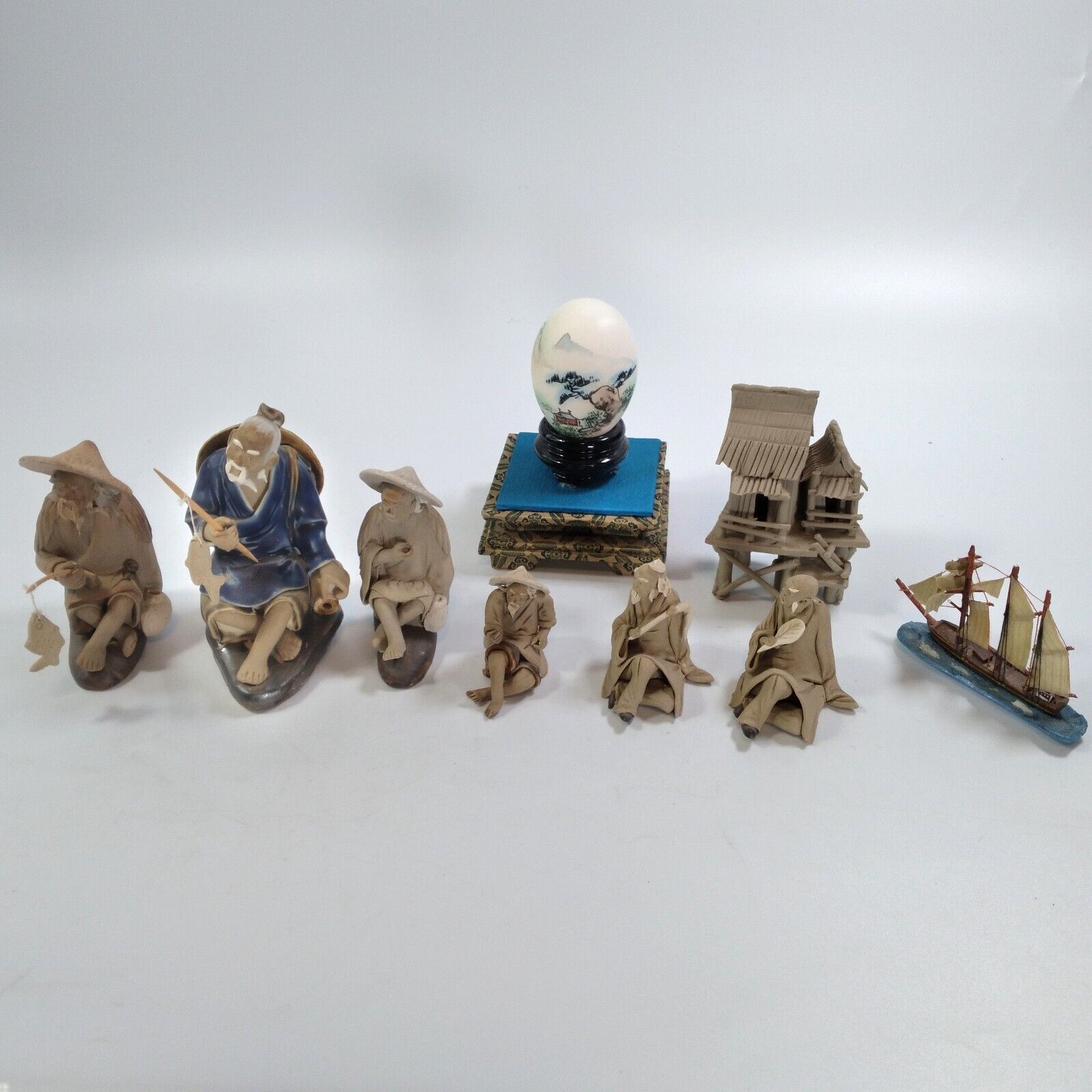9 Pc Vintage Asian MUD MEN Ceramic Figurines Asian Pole House Ship and Egg Art