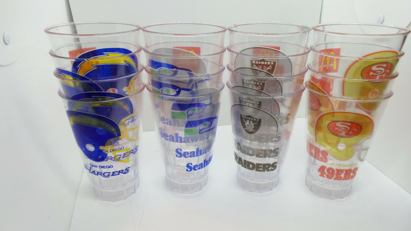 Lot of 16 McDonald\'s / Coke 1980\'s NFL Plastic Team Cups Raiders 49ers Seahawks