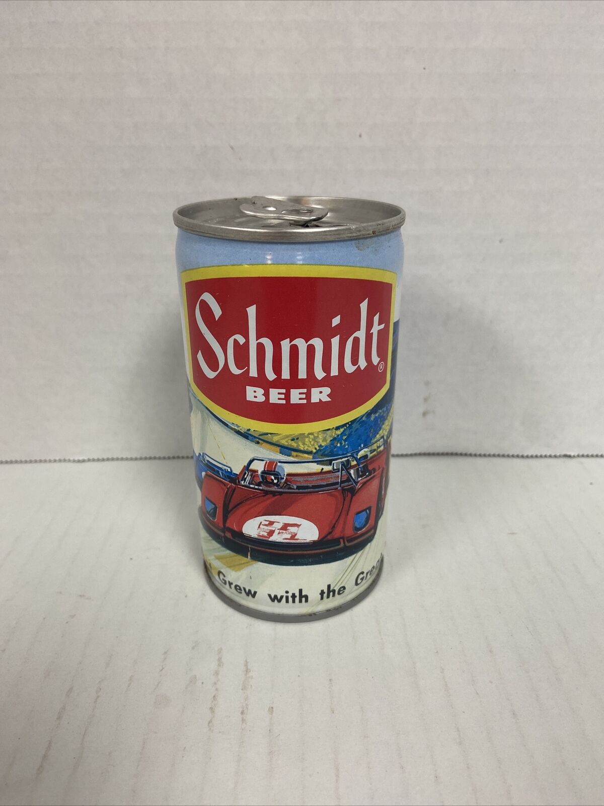Schmidt can yellow band,steel-empty race car and track scene