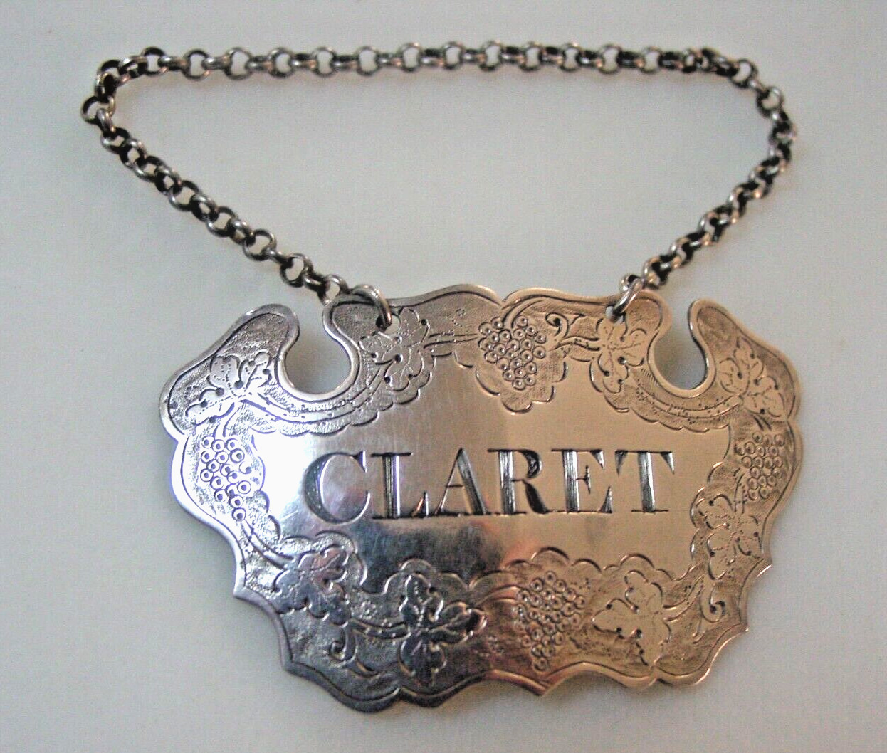 Large, early sterling silver escutcheon decanter label CLARET.  Provincial 1740?