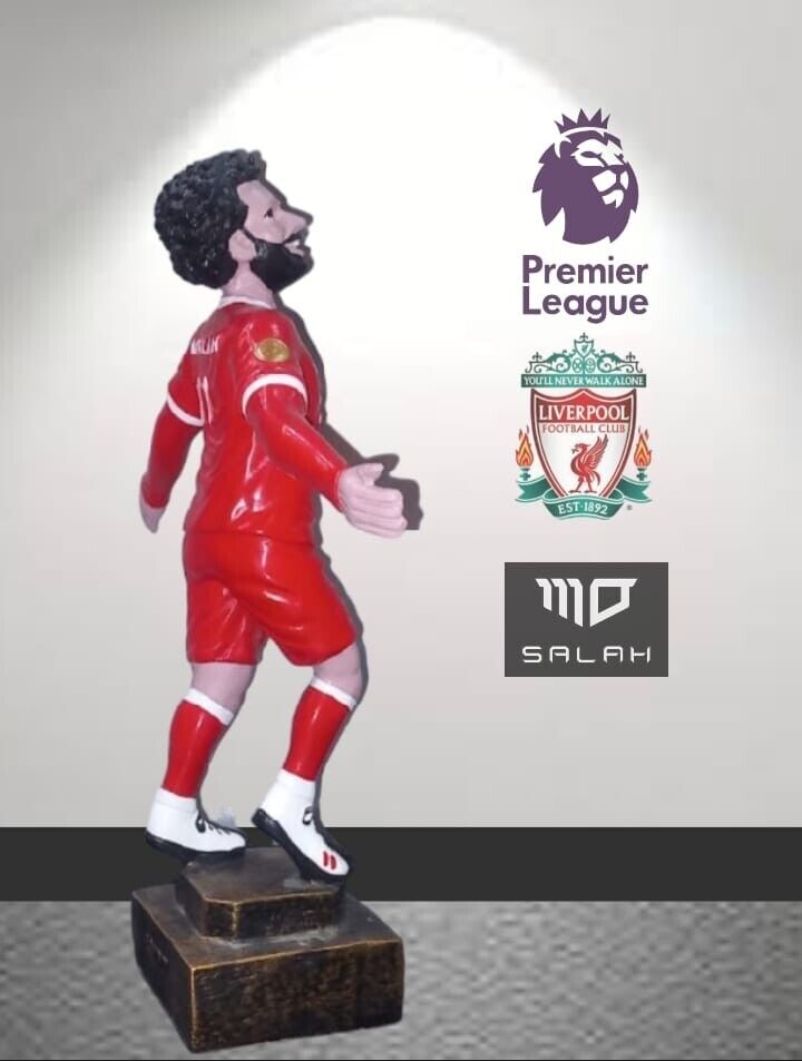 A statue of Premier League and Liverpool FC star Mohamed Salah from Egypt . Red