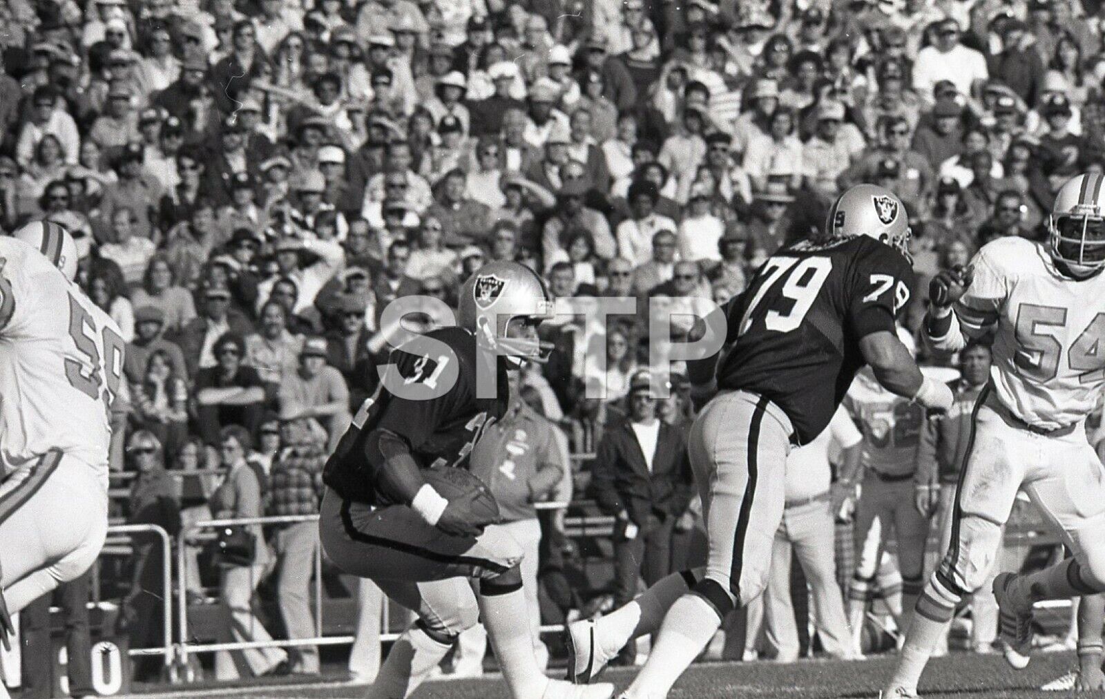 Original NFL Football Negative 1976 Oakland Raiders Carl Garrett & Dan Medlin