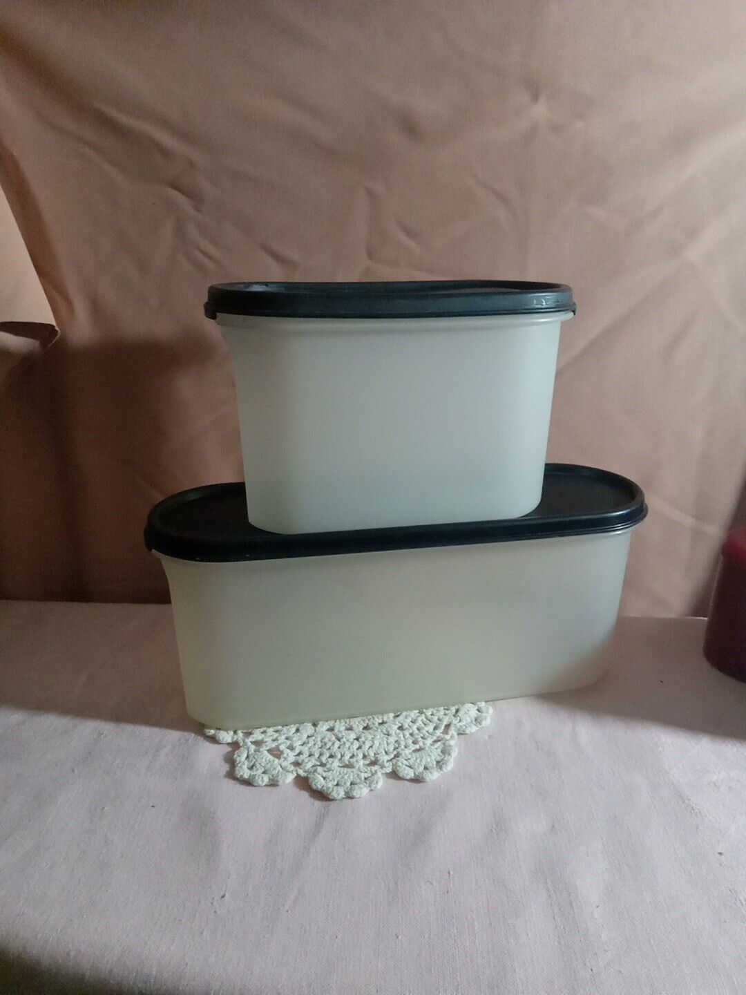 A Pair Of Tupperware #2400A-1 And 1612-14 Storage Containers With Black Lids 