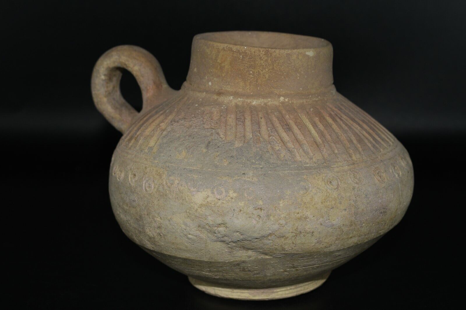 A Large Early Islamic Unglazed Pottery Vessel with Handle Ca. 12th/ 13th Century