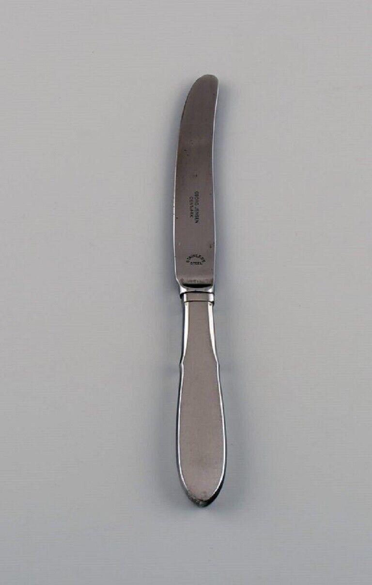 Gundorph Albertus for Georg Jensen. 11 Mitra fruit knives in stainless steel.