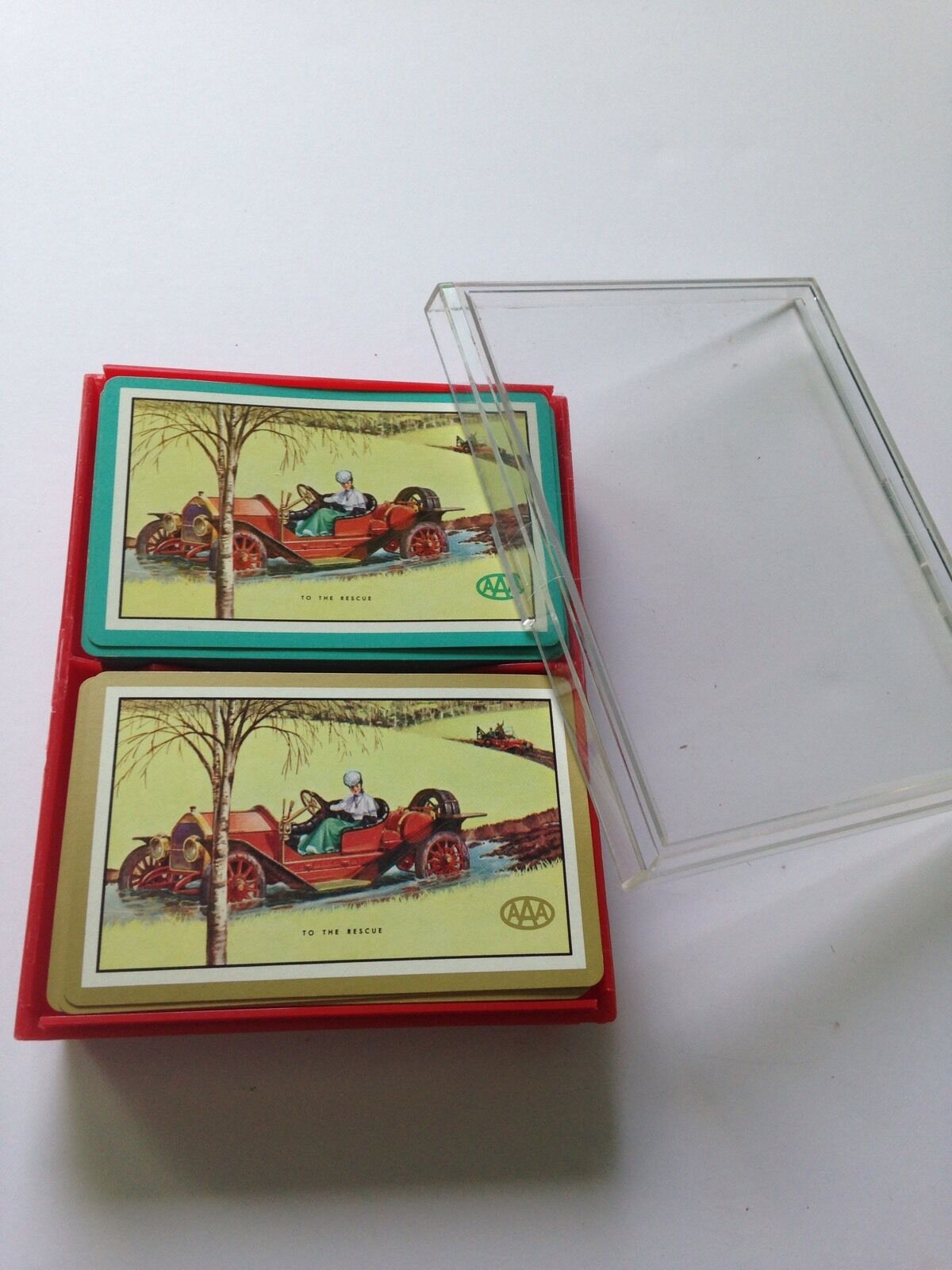 TWO DECKS OF VNITAGE AAA TO THE RESCUE PLAYING CARDS IN RED & CLEAR PLASTIC CASE