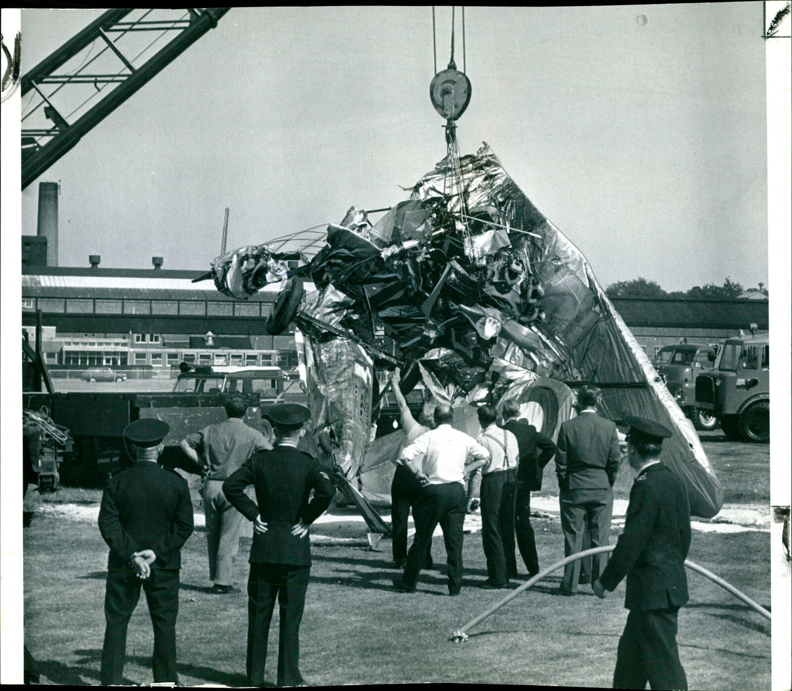 A mobile crane removing the wreckage of the pre... - Vintage Photograph 2043912