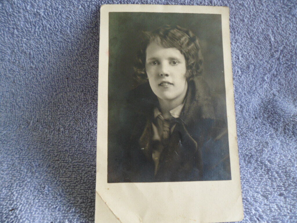 early 20th century post card with young lady on front