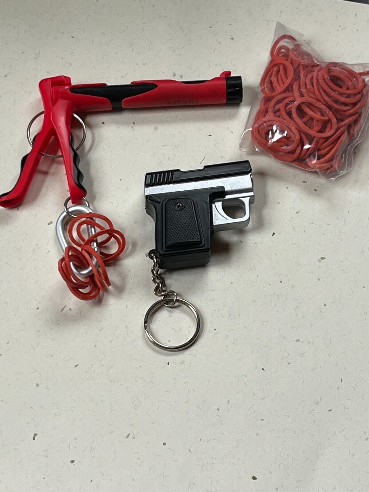 Lot of Red & Black Plastic Rubber Band & Faux Black & Silver Hand Gun Key Ring