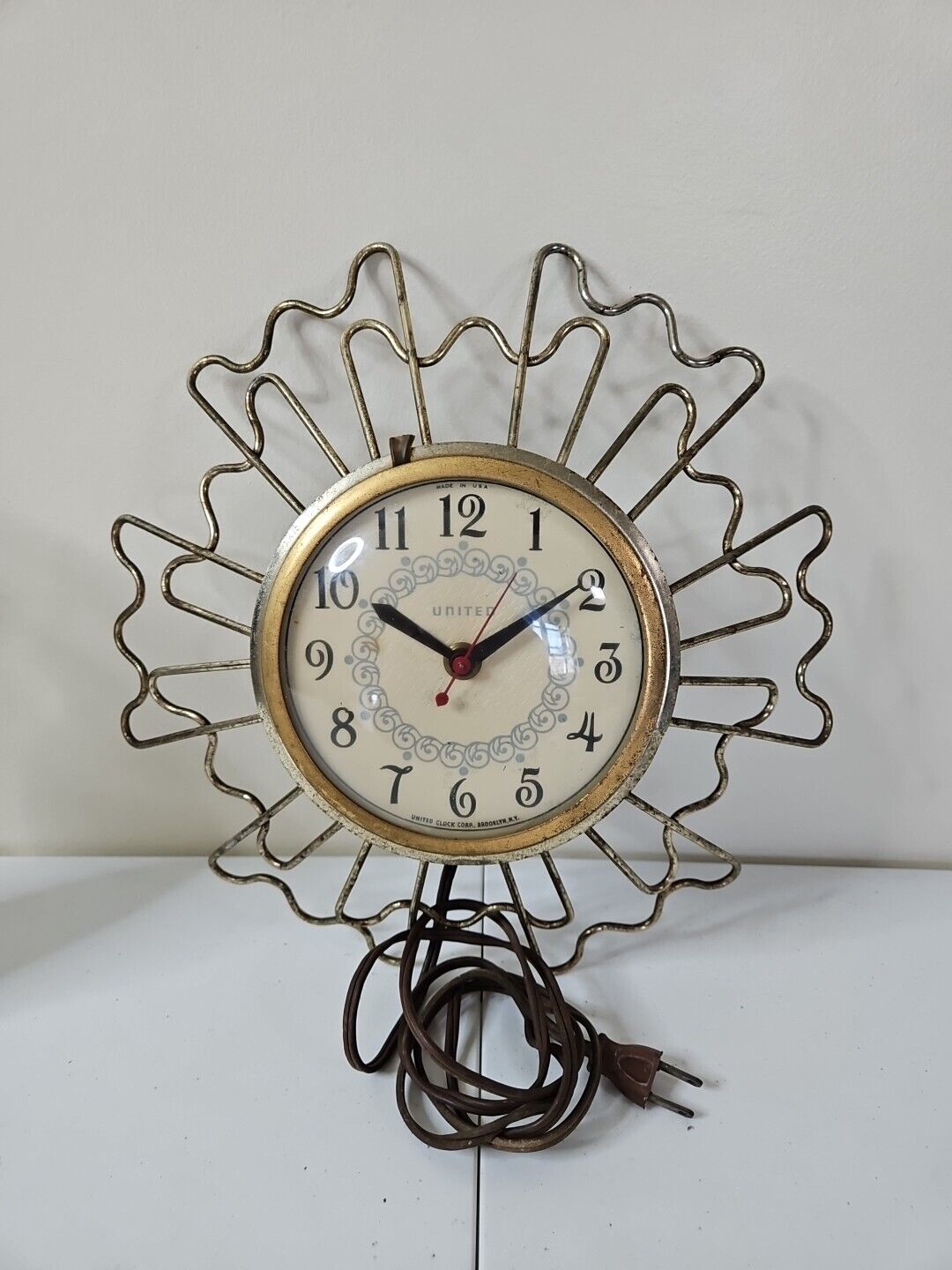 Vintage MCM United gold tone electric wall clock works