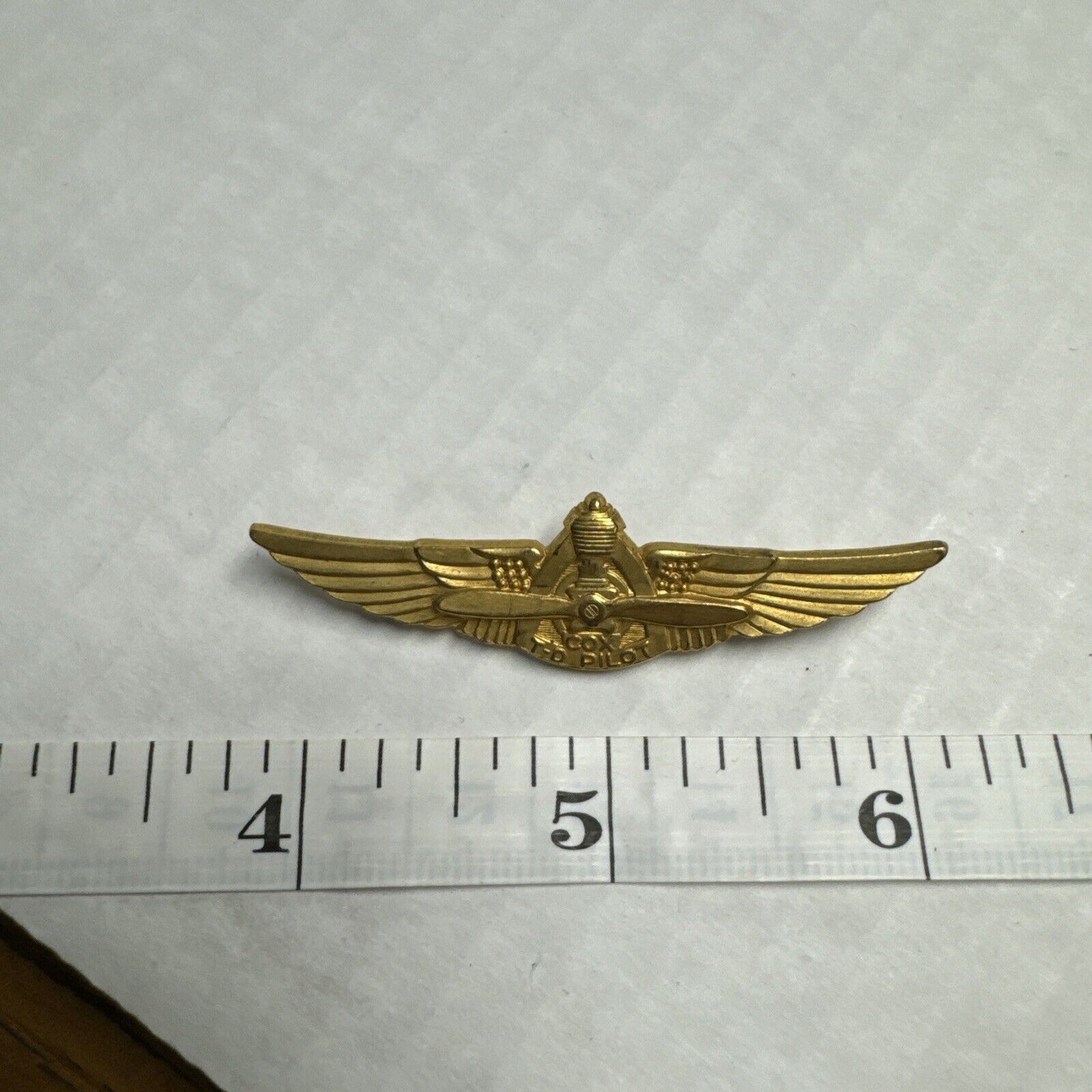 1960S COX TD-PILOT WINGS WALLY WINS HIS WINGS PROMO FILM PIN BACK