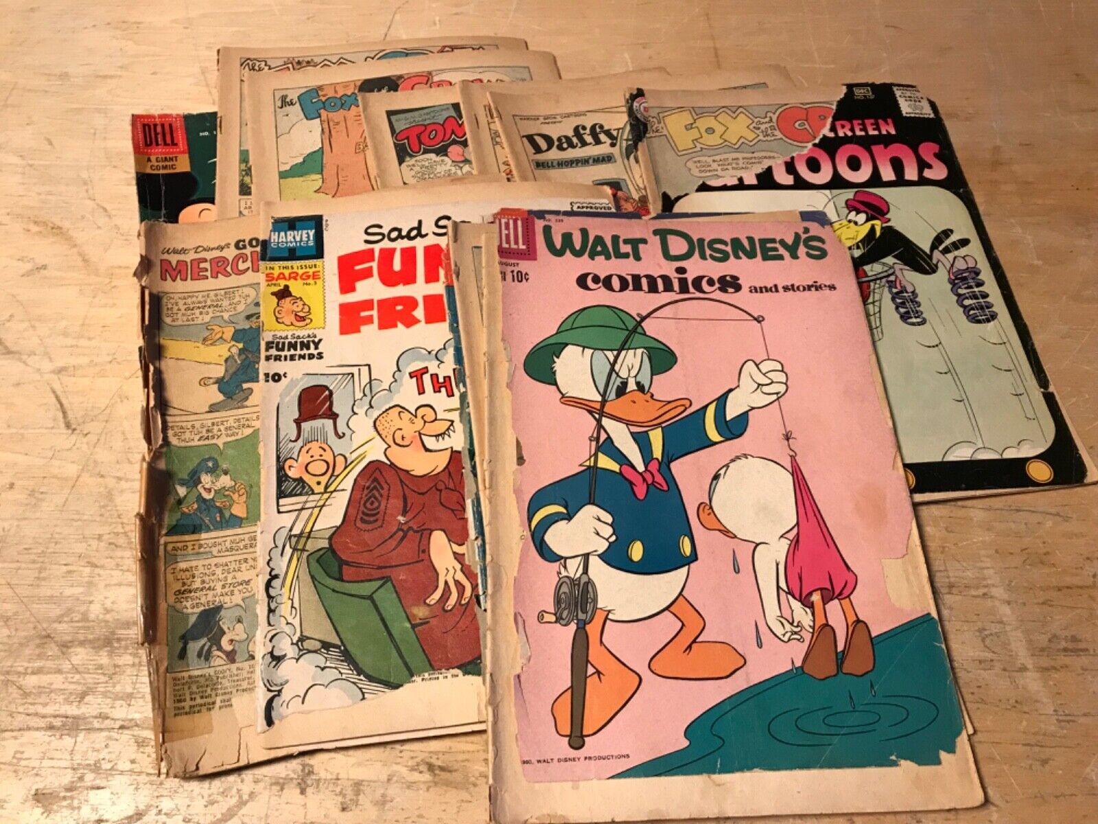 lot of vintage reader copies, old comic books, ripped covers, some 10 cent comic