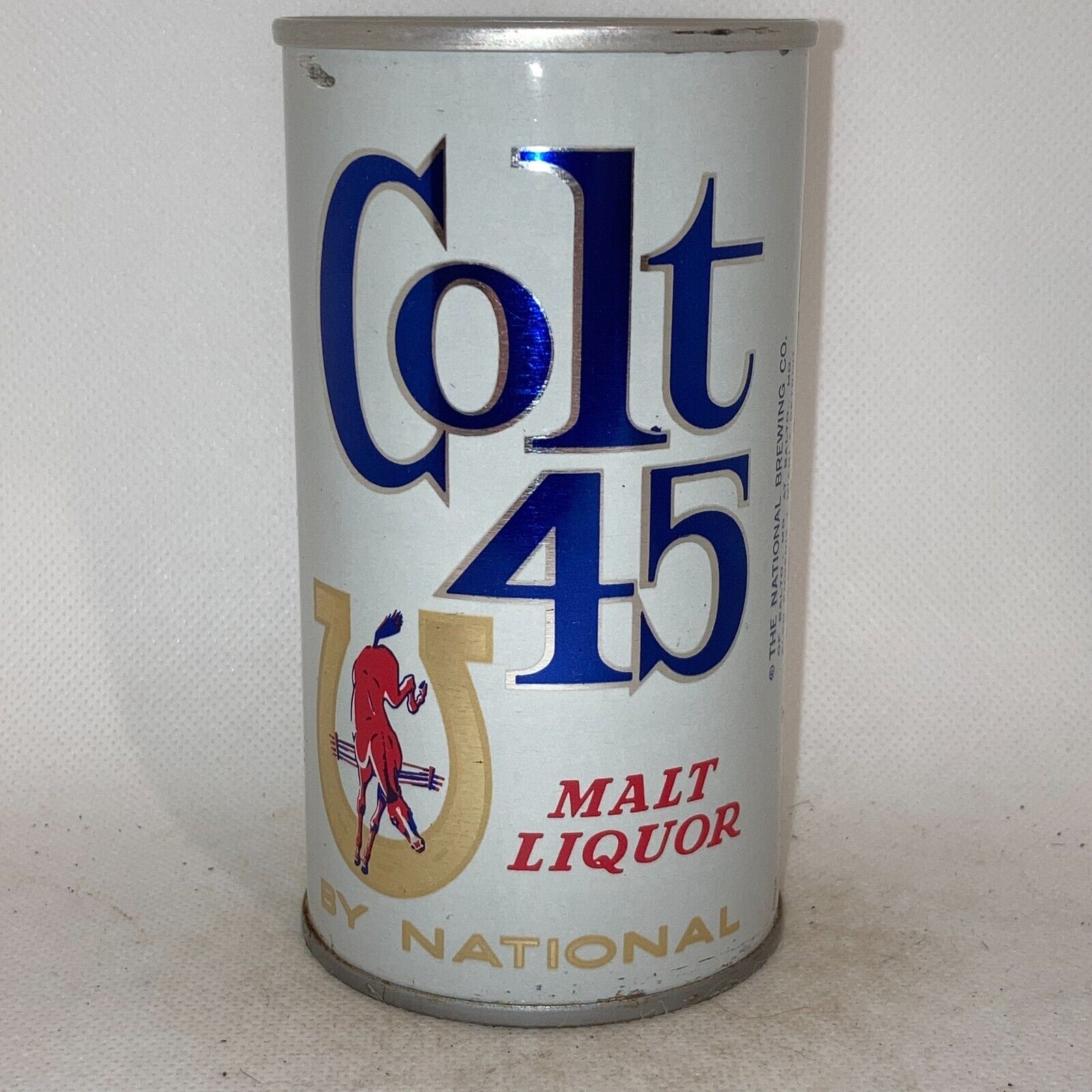 Colt 45 beer can, bottom opened