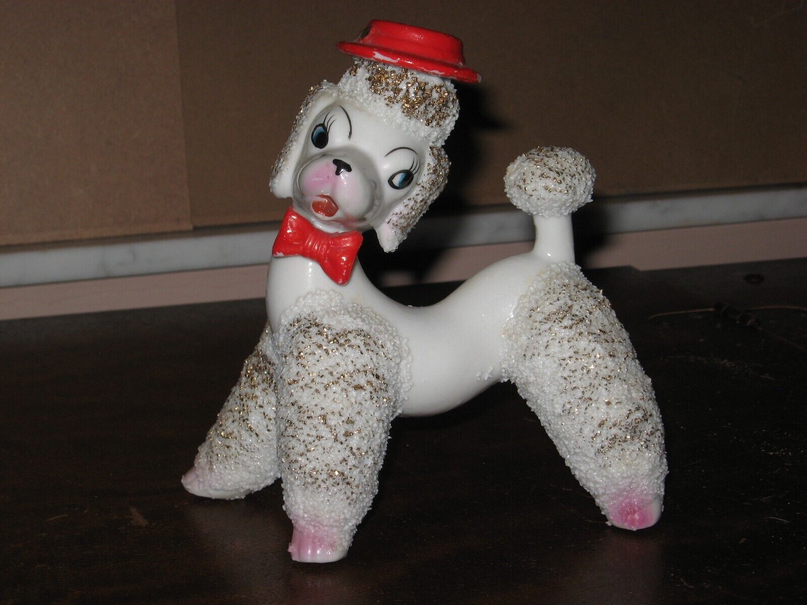 Vintage spaghetti like white poodle with gold leaf highlights and red hat