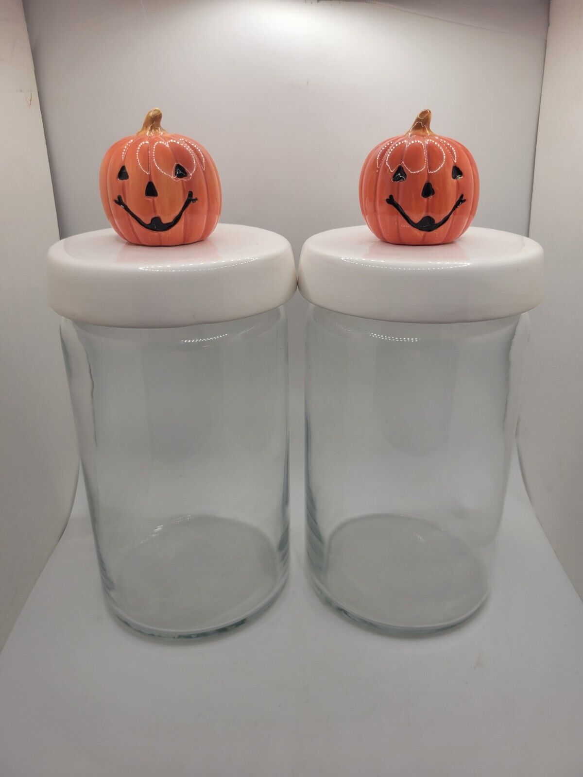 Pair Of Anchor Hocking Glass Storage Canisters with Pumpkin Head Toppers