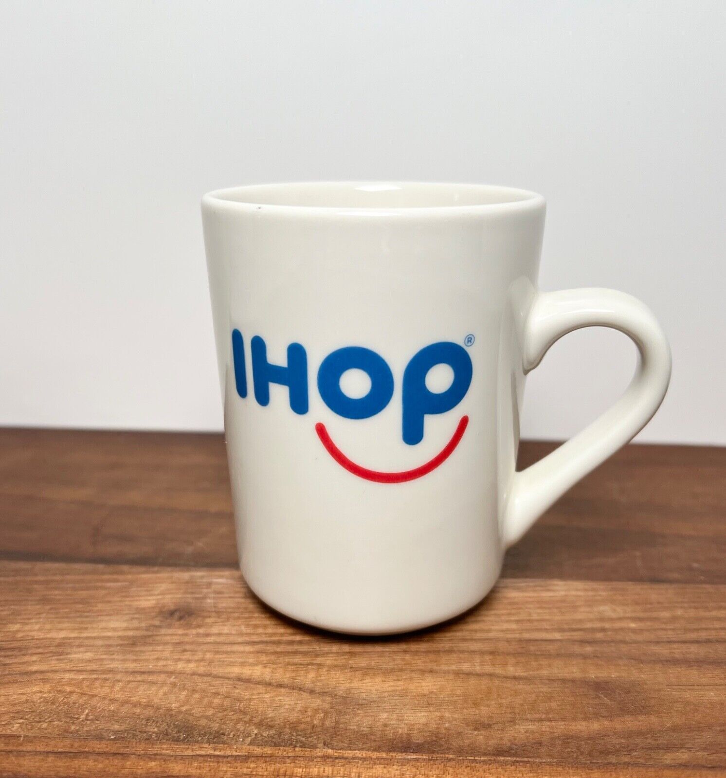 IHOP Restaurant Coffee Mug Red Smiley Face Blue Letters Ceramic Tuxton 8 oz