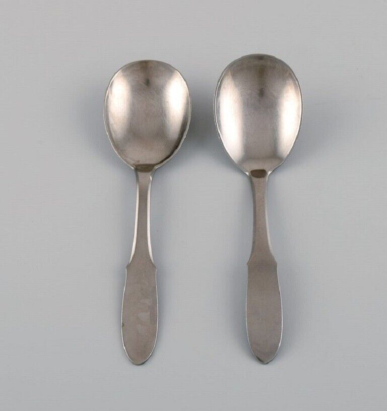 Gundorph Albertus for Georg Jensen. Two Mitra jam spoons in stainless steel.
