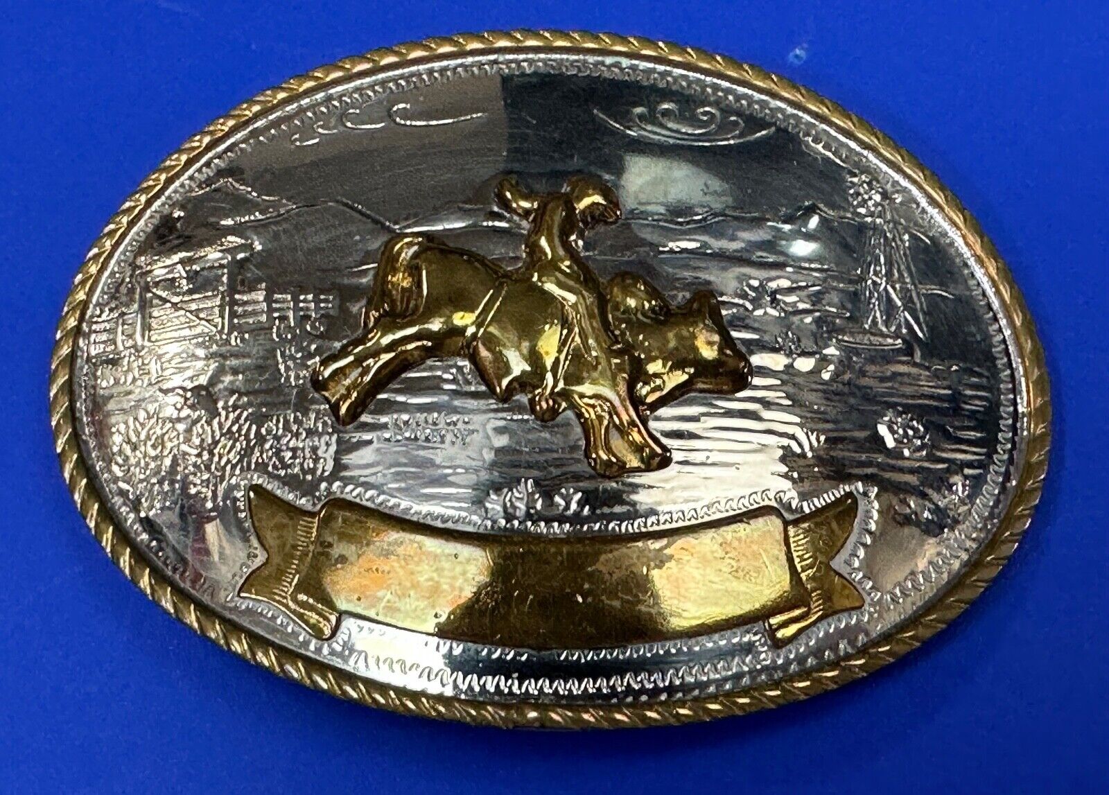 German Silver by Tony Lama belt buckle with blank Award ribbon scroll to engrage