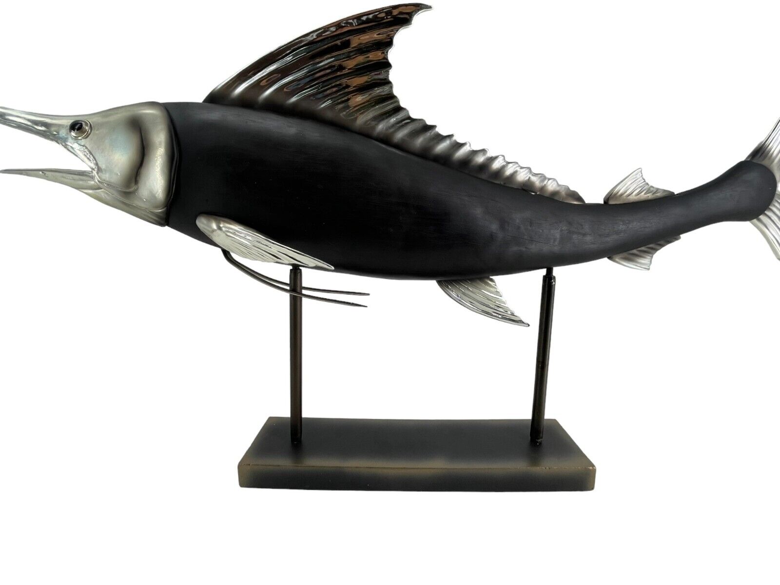 Resin swordfish Metallic silver and black marlin on black stand.