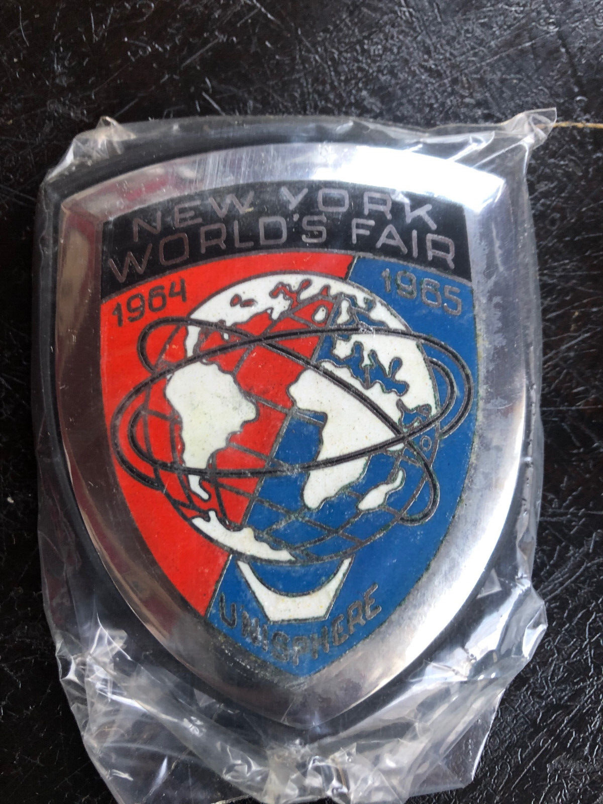 Original New Old Stock World's Fair car grille/scooter badge 1964-1965