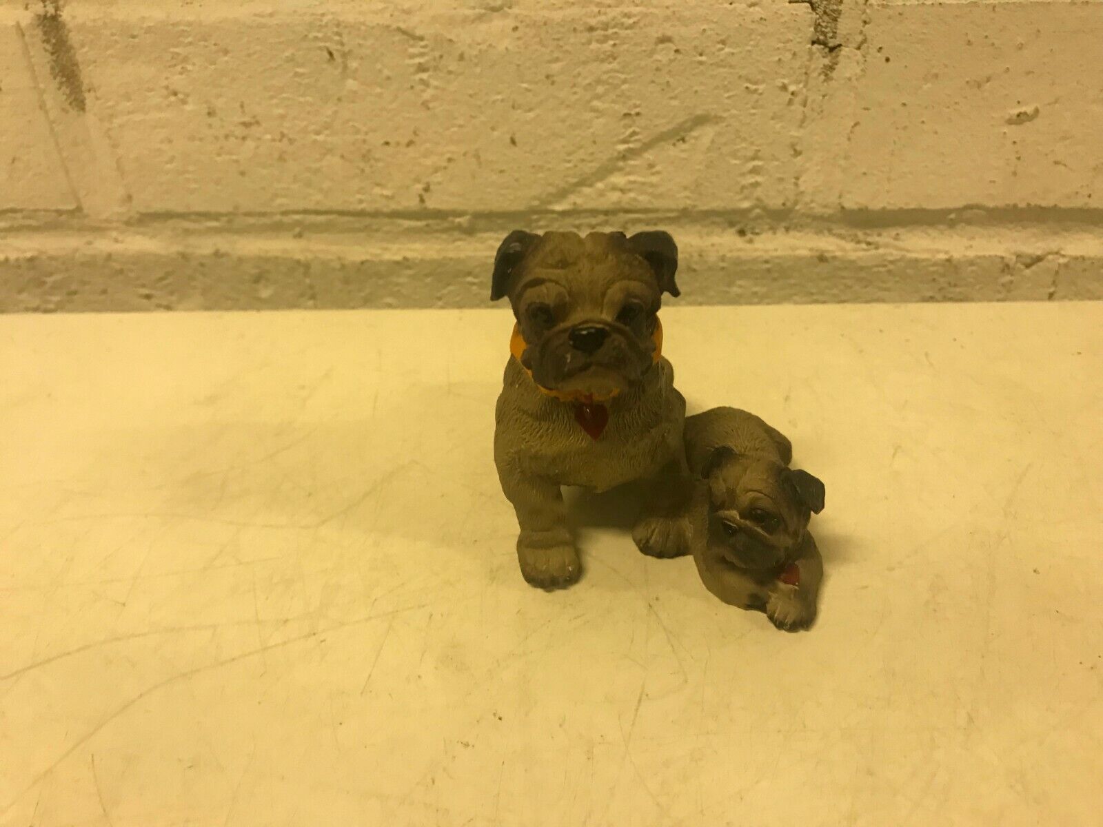 2 Dogs Figurine Possibly Puggle Sitting & Laying with Collars