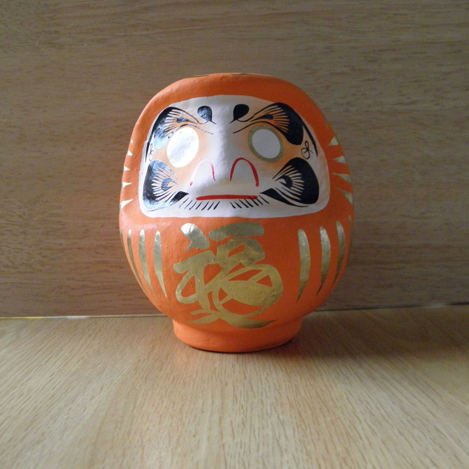 small Daruma Doll in orange color with a pen / Daruma at Takasaki : No 1 size