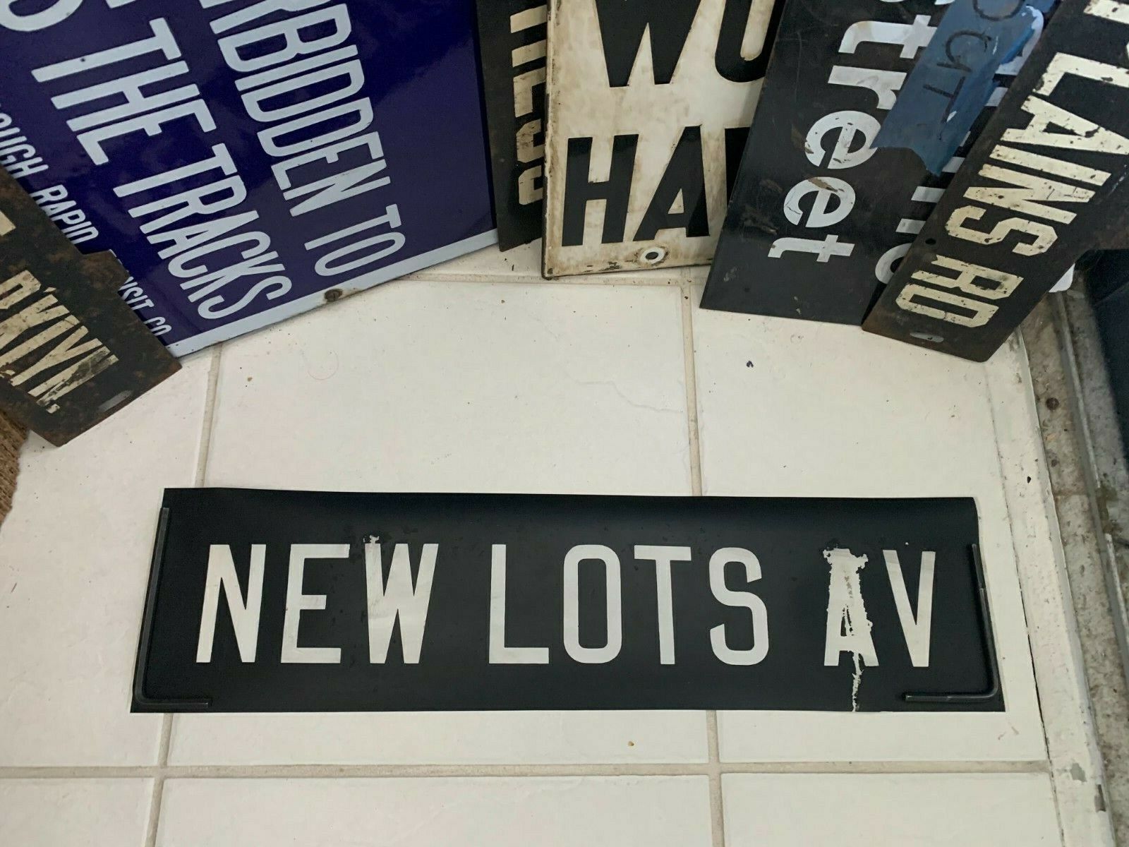 DAMAGED NYC SUBWAY ROLL SIGN NEW LOTS AVENUE BROOKLYN CEMETERY BEIRUT DODGE CITY