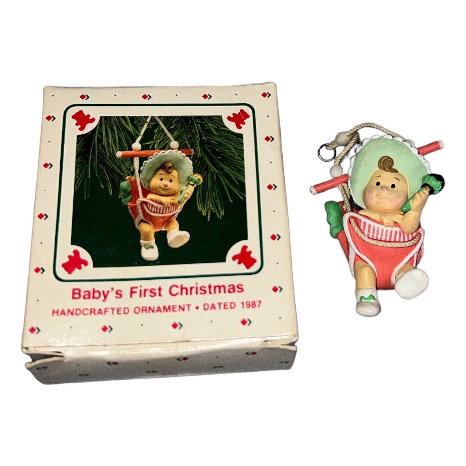Baby\'s First Christmas 1987 Baby Playing In A Bouncer Swing-Hallmark Ornament