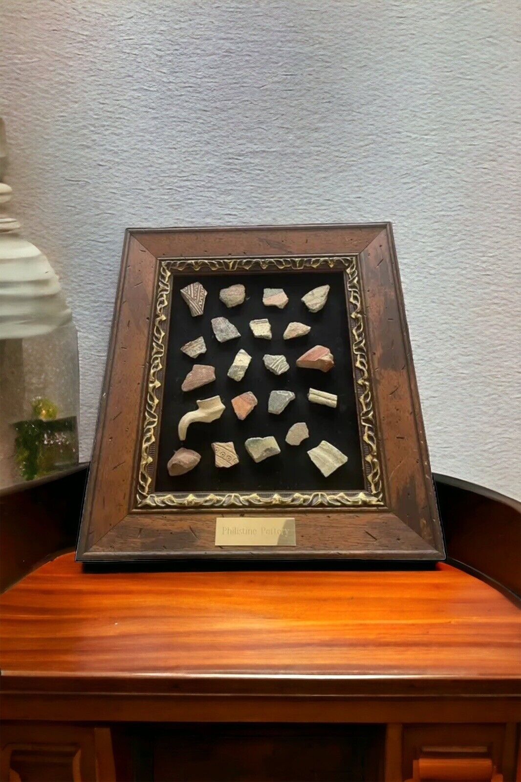 A framed group of Philistine pottery fragments