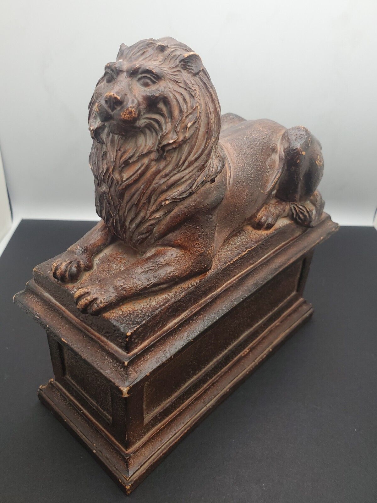Lion Figure Lying On A Pedestal Sculpture