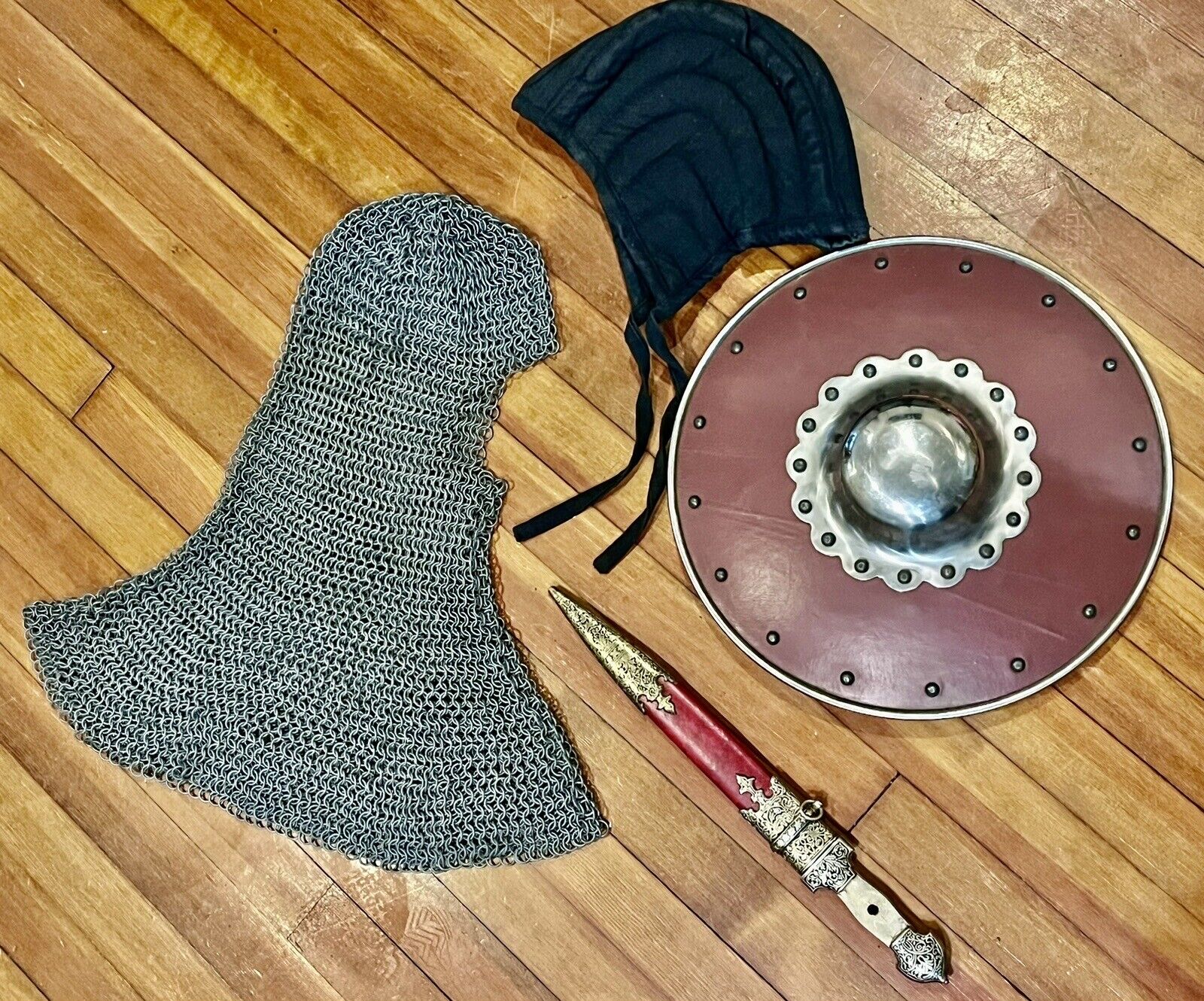 Vintage Medieval Armor Lot With Riveted Coif, Padded Hat, Buckler And Dagger