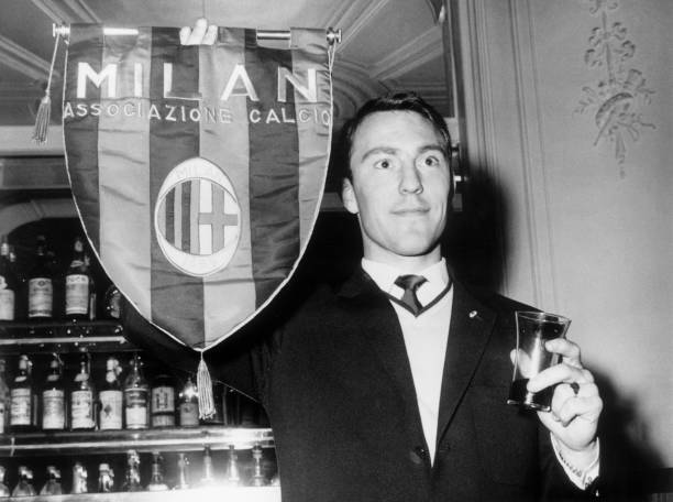 Chelsea striker Jimmy Greaves holds up an AC Milan pennant during vi- Old Photo