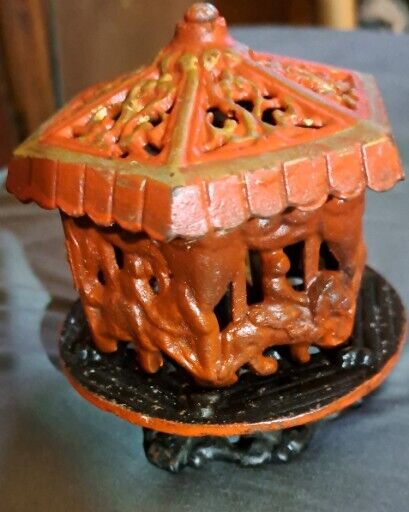 Antique Cast Iron Hand Painted Spinning Carousel Coin Bank