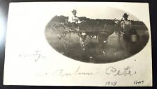 RPPC VINTAGE REAL PHOTO POSTCARD MAN SITTING IN SULKY GETTING READY TO RACE BULL picture
