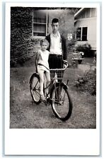 1933 Father And Child Bicycle House Car Scene Vintage RPPC Photo Postcard picture