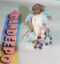 Vintage CWI Angel Figurine With Flowers picture